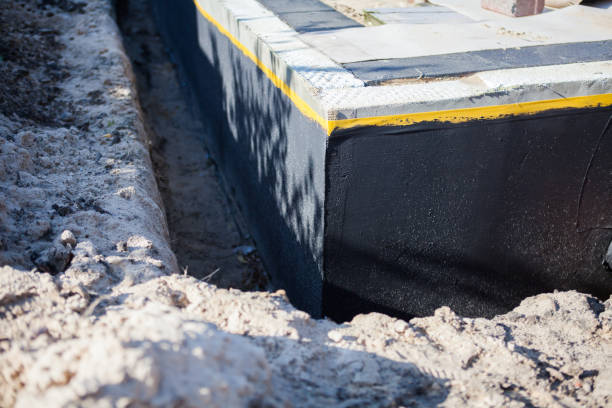 Professional Exterior Waterproofing technician working in Watertown, NY